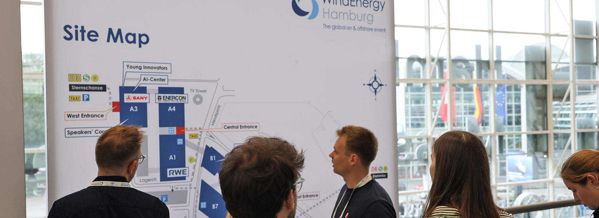 WindEnergy Hamburg 2024 - visitors in front of the site map